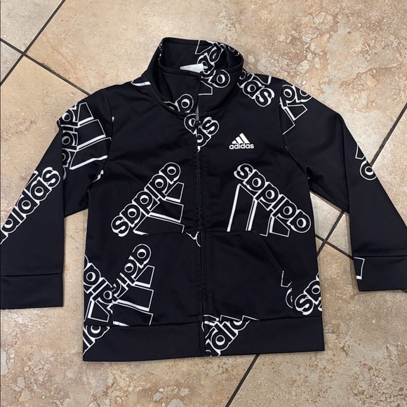 Adidas Black Jacket Zipper up
with White Logo Pattern
2 front Pocket
Size 2 T - Picture 1 of 7